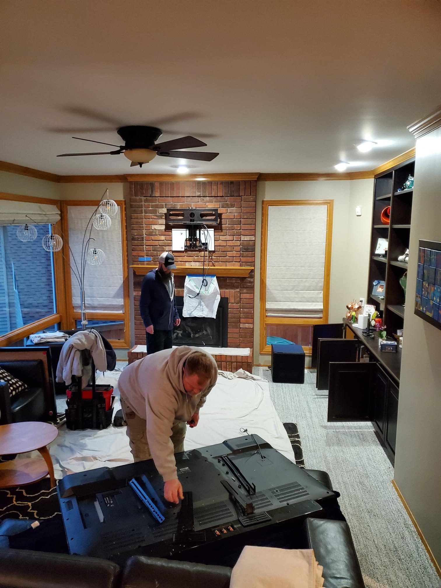 Television upgrade: Equipment replacement and installation in progress.